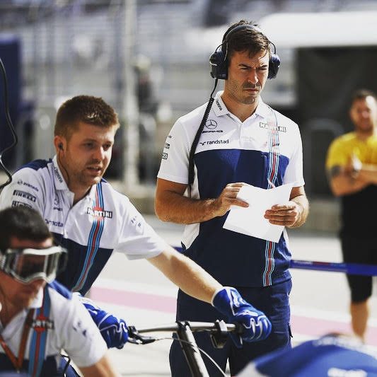 Paul with a clipboard in the Williams garage